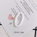 Detail view of a 35x19.5mm creamy white acrylic oval link for DIY jewelry crafting - Simple Creamy White (2#)
