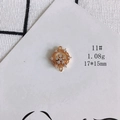 Macro detail of a 17x15mm gold-plated flower pendant with clear cubic zirconia stones - Clustered Floral (11#)