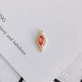 Macro view of marquise resin charm with red opal finish and gold plated zircon frame - Red-Orange (4#)