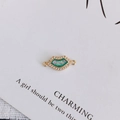 Detail of gold-plated lip pendant with green opal inlay and white zircon micro-pave - 2#