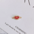 Macro detail of gold-plated red lip charm with zircon inlay for DIY jewelry making - 4#