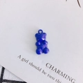 Macro detail of royal blue resin gummy bear pendant for DIY jewelry crafting - Dark Blue