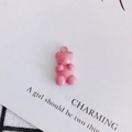 Detailed view of a pink resin gummy bear charm with a metal loop for DIY jewelry making - Pink