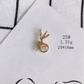 Macro detail of a 18K gold-plated fairy pendant with shimmering zircons and moving stone - Fairy In Circle (25#)