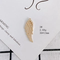 Macro shot of 18k gold plated wing pendant with micro-pave zircons, 36x13mm size - Wing Style (3#)