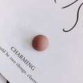 Detail of matte reddish-brown circular resin stud accessory on minimalist display card - Red Brown (3#)