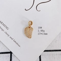 Macro shot of 18k gold plated leaf pendant with white pavé cubic zirconia 27x13mm - Leaf Style (10#)