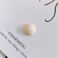 Close-up of a matte beige resin geometric dome cabochon for DIY phone cases and shoes - Off White (7#)