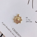 Macro shot of gold alloy starburst charm with pearl center and rhinestones for DIY jewelry - Rudder Pearl Style (6#)