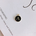 Macro detail of retro alloy alphabet A pendant with black enamel finish for DIY jewelry - Letter A