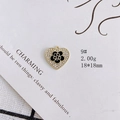 Macro shot of heart-shaped charm with camellia enamel and crystals on white card - Black Camellia Heart Style (9#)