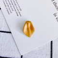 Detailed view of matte mustard yellow resin flower petal charms for DIY jewelry making - 2#