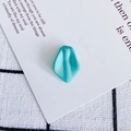 Close-up of mint green resin petal charms with pre-drilled holes for DIY jewelry making - 3#