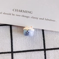 Macro shot of handcrafted light blue ceramic lucky cat beads with plum blossom patterns - Light Blue Dark Blue Floral Style (6#)