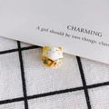 Detail shot of a handmade ceramic Maneki Neko bead with colorful floral patterns - Red Green Floral Style (4#)