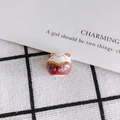 Detailed view of hand-painted ceramic lucky cat beads with gold trim and floral patterns - Pink Wafuu Style (5#)