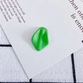 Macro detail of matte green resin petal pendant with hole for DIY jewelry making - 12#