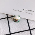 Macro view of green ceramic lucky cat bead with pink cherry blossom and golden details - Dark Green Style (8#)
