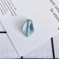 Detail view of a matte grey-blue resin petal charm with a single hole for DIY jewelry - 13#