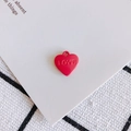 Detail view of a red heart-shaped metal pendant with LOVE engraving for DIY jewelry - Red (4#)