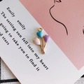 Detail of colorful enamel heart balloon charms in pink, blue, and purple for DIY jewelry - Multicolor