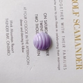 Macro shot of purple spiral textured resin bead for DIY shoe charms and crafts - Purple