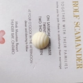 Macro detail of cream-white round resin bead with spiral texture for DIY crafts - Cream White