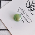 Macro detail of round marble resin cabochon with green and gold swirl for DIY jewelry - Green Gold Marble Style (1#)