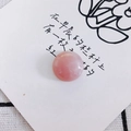Close-up of polished round rose quartz stone bead with natural texture on a white card - Pale Pink Crystal Style (6#)
