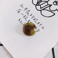Close-up of round amber resin marble charm with green and brown swirls for DIY crafts - Coffee Green Swirl Style (13#)