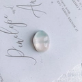 Macro detail of oval translucent resin bead with turquoise stripes on art card - Blue-White Translucent Striped Style (3#)