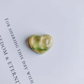 Detailed view of heart-shaped resin charms with yellow and green marble texture - Yellow And Green Marble (2#)