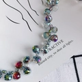 Macro detail of faceted crystal glass teardrop beads with vibrant iridescent AB coating - Faceted Water Drop and Round Bead Style / Strand Style / Iridescent Blue-Green (1#)