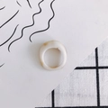 Detail shot of wide cream resin ring with light brown marble texture on plaid background - Cream Marble (3#)