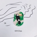 Detail view of oval acrylic parrot charm 40x25mm with tropical green leaf patterns - Tropical Toucan Style (5#)