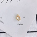 Macro view of a 15x9mm gold plated oval metal pendant for DIY jewelry making - Minimalist Small Oval Style (6#)