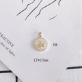 Macro view of a 17x15mm 18k gold plated shell pendant with an angel relief detail - Angel Relief Round Style (6#)