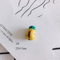 Detail view of 22x14mm handmade yellow ceramic bead with cute cartoon tie figure - Egg Figure Shape (2#)
