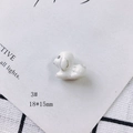 Detailed macro view of a 18x15mm puppy-shaped ceramic pendant with marble texture - Marble Pattern Dog Style (3#)