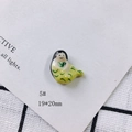 Macro shot of a handmade ceramic mermaid charm, 19x20mm size with green hand-painted finish - Cartoon Mermaid Style (5#)