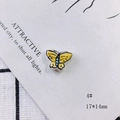 Macro detail of yellow ceramic butterfly bead with hand-painted patterns measuring 17x14mm - Butterfly Style (4#)