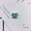 Detail of 17x13mm green and yellow butterfly ceramic bead with glossy finish and black outlines - Butterfly Design(5#)