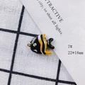 Detailed close-up of a 22x18mm striped tropical fish ceramic bead for DIY jewelry crafts - Black Yellow White Striped Fish (7#)