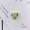Macro view of 18x14mm yellow butterfly ceramic bead with hand-painted wing details - Butterfly Shape (11#)