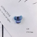 Macro detail of a 17x13mm handmade purple ceramic butterfly bead for DIY jewelry craft - Butterfly Style (12#)