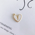 Macro shot of heart-shaped charm with gold beaded edges and white inlay for DIY jewelry - White (2#)