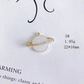 Macro detail of a gold Saturn pendant with white enamel and sparkling rhinestones - White Planet Saturn Style (5#)