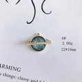 Macro shot of 22x16mm gold Saturn pendant with blue inlay and rhinestone details - Blue Green Planet Saturn Style (6#)
