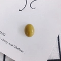 Macro detail of a polished oval green-yellow resin gemstone for DIY jewelry making - Greenish Yellow (3#)
