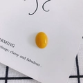 Close-up of a glossy yellow oval resin gemstone for DIY jewelry and phone case crafts - Yellow (10#)
